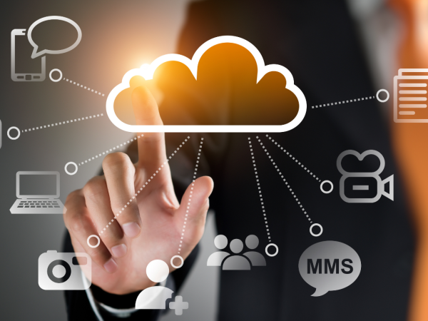 Transparent icons such as cloud, letter, person, laptop, camera, documents etc. A person is seen in the background clocking on the icons.
