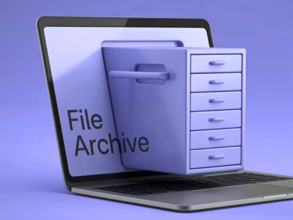An open laptop with a filing cabinet protruding out from the screen with the words 'FILE ARCHIVE' 