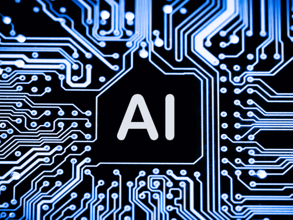 A black background with blue, grey and white lit up wired and cables leading from the centre word 'AI' 