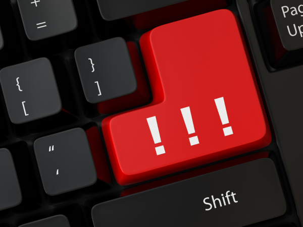 A black keyboard with 1 red button containing 3 exclamation marks 