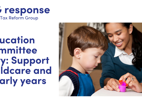 LITRG Response: Education Committee inquiry: Support for childcare and the early years. image of a childcare provider supporting a small child with their education.