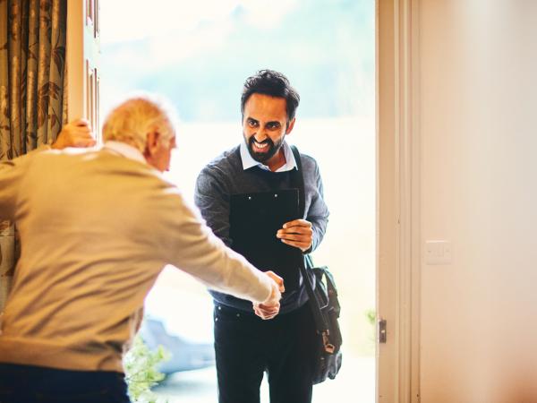 Carer and elderly man