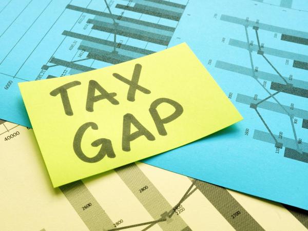 Image of a note with the words tax gap on it