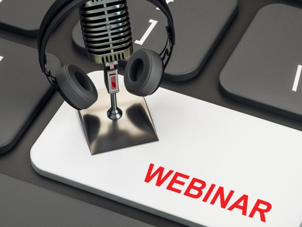 Image of webinar button on a keyboard with a microphone and headphones