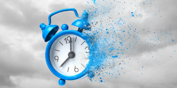 grey clouds in the background with a blue clock fading away into dust grey clouds in the background with a blue clock fading away into dust