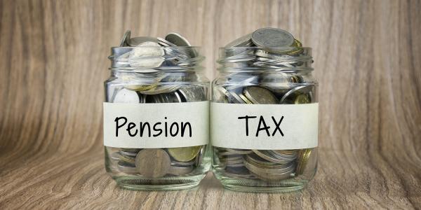 2 jars containing coins one has a label saying 'PENSION' the other has a label saying 'TAX' 2 jars containing coins one has a label saying 'PENSION' the other has a label saying 'TAX'