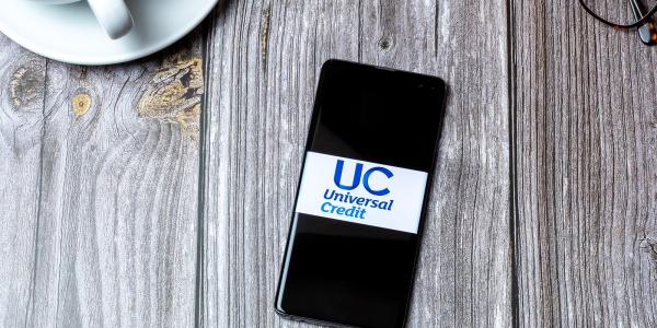 a mobile phone showing Universal credit on the screen