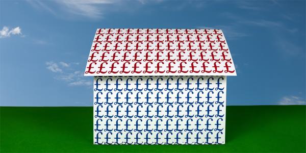 a house with Red pound signs decorating the roof and blue pound signs decorating the body of the house. Green grass and a blue sky in the background.