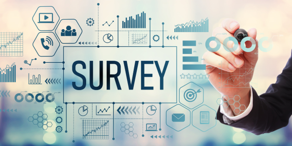 a person writing on a board filled with graphs, charts and icons, with the word 'SURVEY' in the middle 