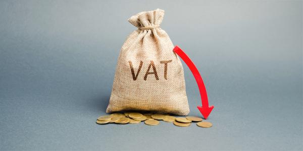 a brown sack with the word 'VAT' written on it, coins scattered across the floor. Next to the bag is a red arrow pointing downwards. a brown sack with the word 'VAT' written on it, coins scattered across the floor. Next to the bag is a red arrow pointing downwards.