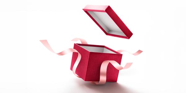 a n open red gift box with pink ribbon on a white background.