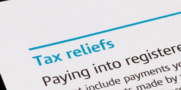 paperwork with the words 'TAX RELIEFS' showing paperwork with the words 'TAX RELIEFS' showing