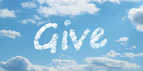 a blue sky with a scattering of white clouds, in the centre is the word 'GIVE' written in clouds. 