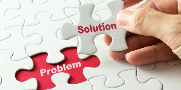 a white jigsaw puzzle on a red background, one piece is missing, the missing puzzle piece says 'SOLUTION' on it in red text, the space where the missing piece needs to go, shows the red background with white writing on it saying 'PROBLEM' a white jigsaw puzzle on a red background, one piece is missing, the missing puzzle piece says 'SOLUTION' on it in red text, the space where the missing piece needs to go, shows the red background with white writing on it saying 'PROBLEM'