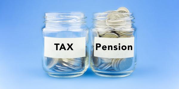 2 glass jars of coins, both have labels on them, one says 'TAX' and the other 'PENSION'