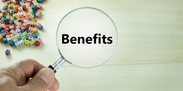 a person holding a magnifying glass which reads 'BENEFITS' scattered across the top left are small coloured beads with letters on. 