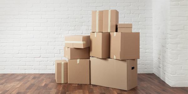 a large pile of moving boxes a large pile of moving boxes