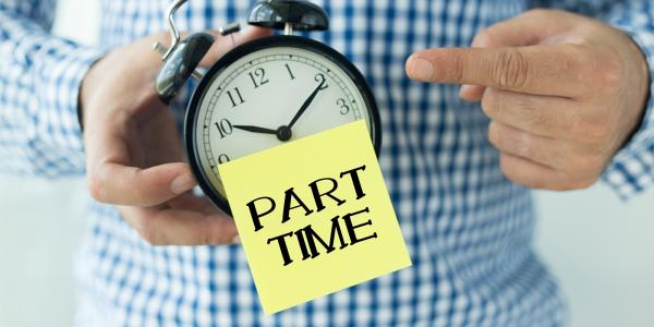 a person holding a clock, on the clock is a sticky note with the words 'PART TIME' in black ink. a person holding a clock, on the clock is a sticky note with the words 'PART TIME' in black ink.