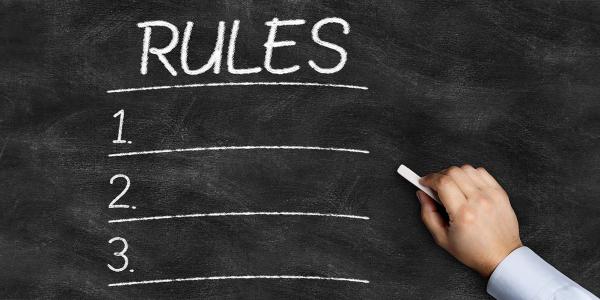 a chalkboard with the word 'RULES' written in white chalk across the top, the numbers 1,2, and 3 are written down the side. a chalkboard with the word 'RULES' written in white chalk across the top, the numbers 1,2, and 3 are written down the side.