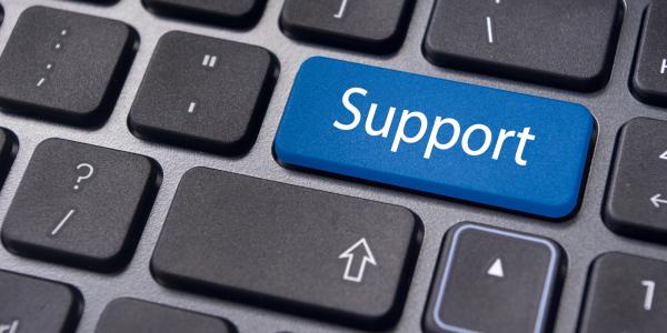 A keyboard with a blue coloured key with the word 'SUPPORT' typed on it in white text. A keyboard with a blue coloured key with the word 'SUPPORT' typed on it in white text.