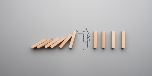 wooden blocks falling on one another then an outline of a person with their hand held out stopping the blocks from falling further wooden blocks falling on one another then an outline of a person with their hand held out stopping the blocks from falling further