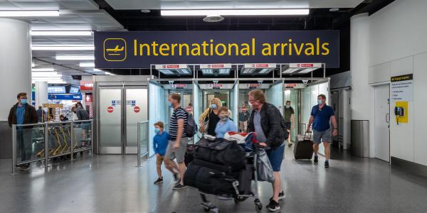 'INTERNATIONAL ARRIVALS' sign in a UK airport 'INTERNATIONAL ARRIVALS' sign in a UK airport