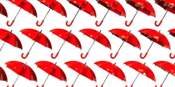Many red umberella's against a white background Many red umberella's against a white background
