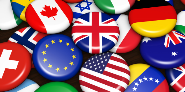 Pile of circular items with international flags printed on them.