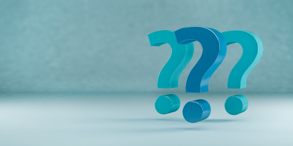 Question marks against a blue background. Question marks against a blue background.