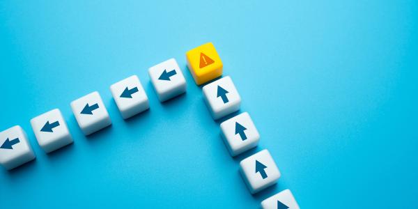 Small blocks with arrows on them in a row pointing upwards, then a warning triangle block, from here the arrow blocks point to the left and head in that direction. Small blocks with arrows on them in a row pointing upwards, then a warning triangle block, from here the arrow blocks point to the left and head in that direction.