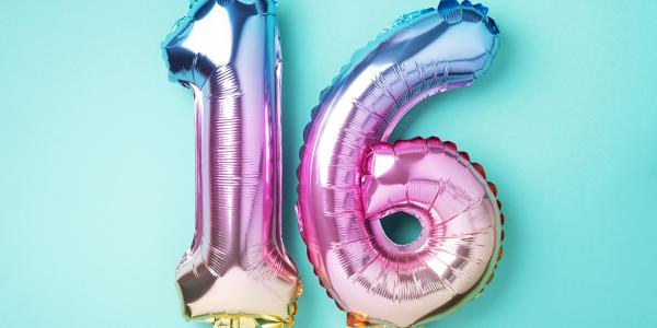 Birthday balloons of the number '16' against a blue background. Birthday balloons of the number '16' against a blue background.