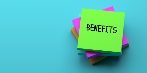 Pile of post-it notes the top note reads 'BENEFITS'. Pile of post-it notes the top note reads 'BENEFITS'.