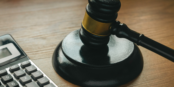 A calculator, a judges hammer and gavel. 