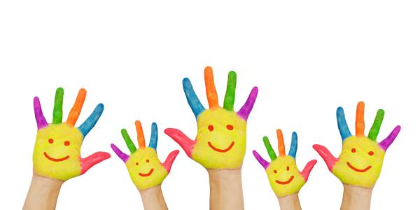 5 hands raised, on each hand a smiley face is painted on the palm with the fingers each painted a different colour. 5 hands raised, on each hand a smiley face is painted on the palm with the fingers each painted a different colour.