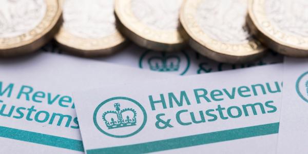 Letters from HMRC showing the HMRC logo with pound coins scattered across the top of these letters. Letters from HMRC showing the HMRC logo with pound coins scattered across the top of these letters.