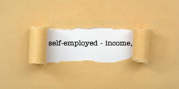 Brown paper with a tear in the centre, through the tear you can see a white background with the words 'SELF EMPLOYED - INCOME' in black text. Brown paper with a tear in the centre, through the tear you can see a white background with the words 'SELF EMPLOYED - INCOME' in black text.