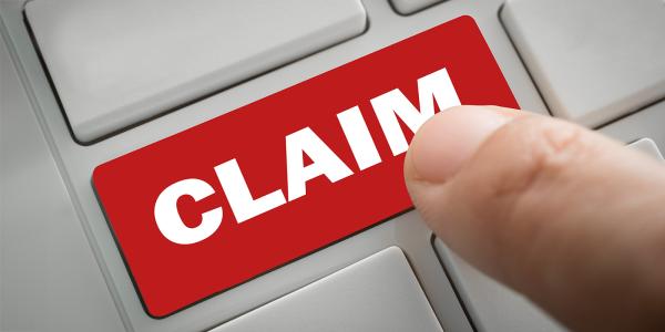 A red computer key with the word 'CLAIM' on it in white text. A red computer key with the word 'CLAIM' on it in white text.