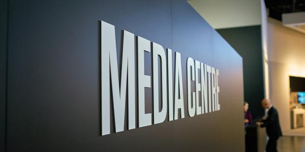 a wall with the words 'MEDIA CENTRE' a wall with the words 'MEDIA CENTRE'