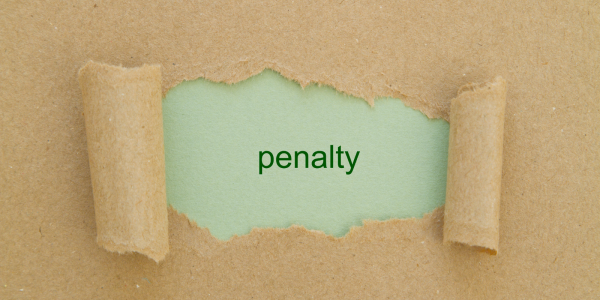 brown paper with a tear in the centre, through the tear you can see a pale green background with the word 'PENALTY' in dark green text