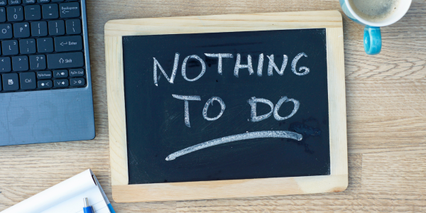 Chalk board with the words 'NOTHING TO DO' written in white chalk. Chalk board with the words 'NOTHING TO DO' written in white chalk.