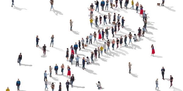 People stood against a white background, arranged in the shape of a question mark. People stood against a white background, arranged in the shape of a question mark.