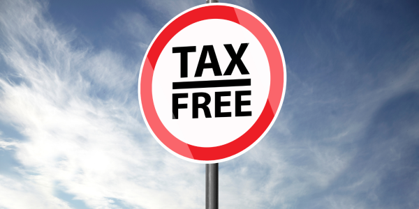 a red circular road traffic sign with the words 'TAX FREE' on it in black text. a red circular road traffic sign with the words 'TAX FREE' on it in black text.