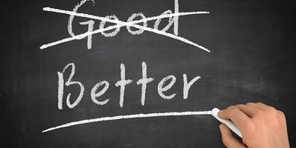 Chalkboard with the words 'GOOD' and 'BETTER' the word 'GOOD' has been crossed through Chalkboard with the words 'GOOD' and 'BETTER' the word 'GOOD' has been crossed through