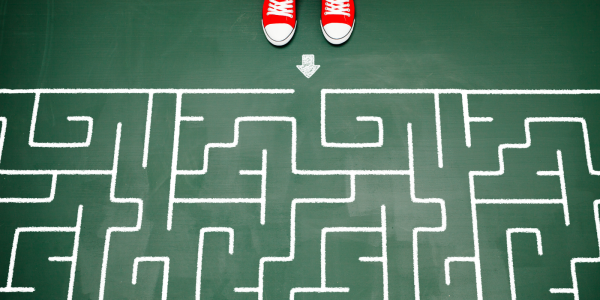 A person stood at the start of a maze A person stood at the start of a maze