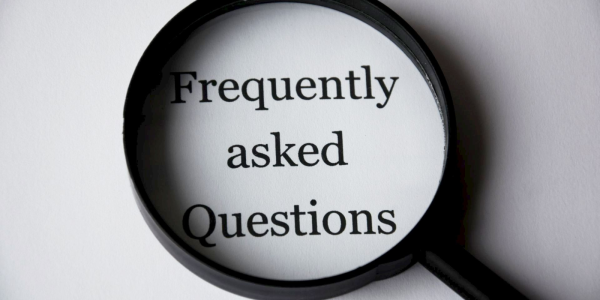 Magnifying glass hovering over the words 'FREQUENTLY ASKED QUESTIONS' Magnifying glass hovering over the words 'FREQUENTLY ASKED QUESTIONS'