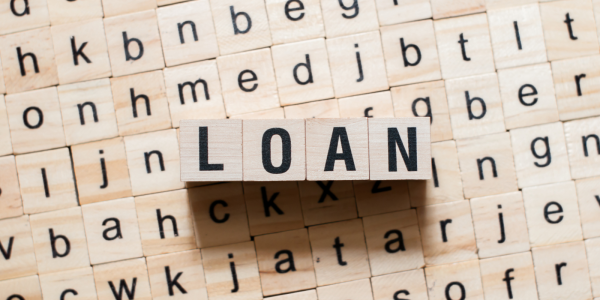 wooden blocks each with a letter on them spelling out the word 'LOAN'' wooden blocks each with a letter on them spelling out the word 'LOAN''