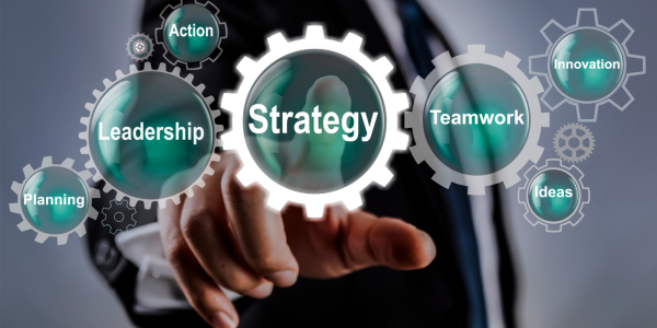 Translucent cogs each with words on them 'STRATEGY', 'LEADERSHIP', 'TEAMWORK', 'INNOVATION', 'ACTION', 'PLANNING'. Translucent cogs each with words on them 'STRATEGY', 'LEADERSHIP', 'TEAMWORK', 'INNOVATION', 'ACTION', 'PLANNING'.