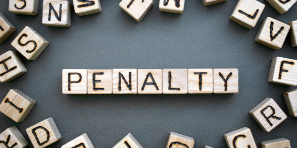 wooden letters spelling out the word 'PENALTY'