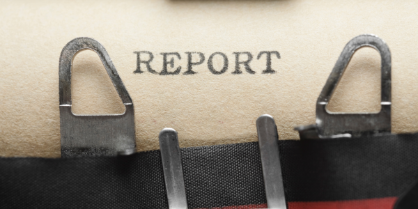 The word 'REPORT' typed on brown paper The word 'REPORT' typed on brown paper