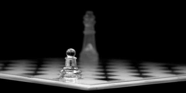A chessboard with 2 glass chess pieces left A chessboard with 2 glass chess pieces left